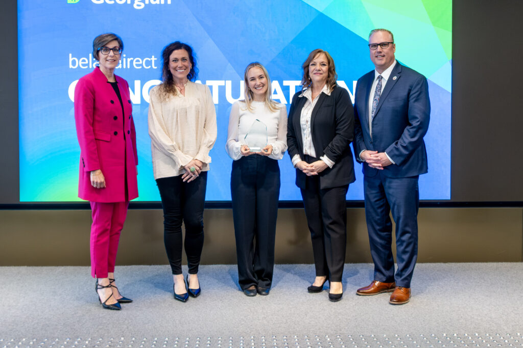 belairdirect members accept Community Partner Award.