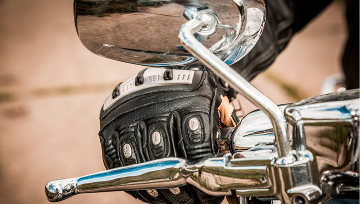 hand on motorcycle handle bar