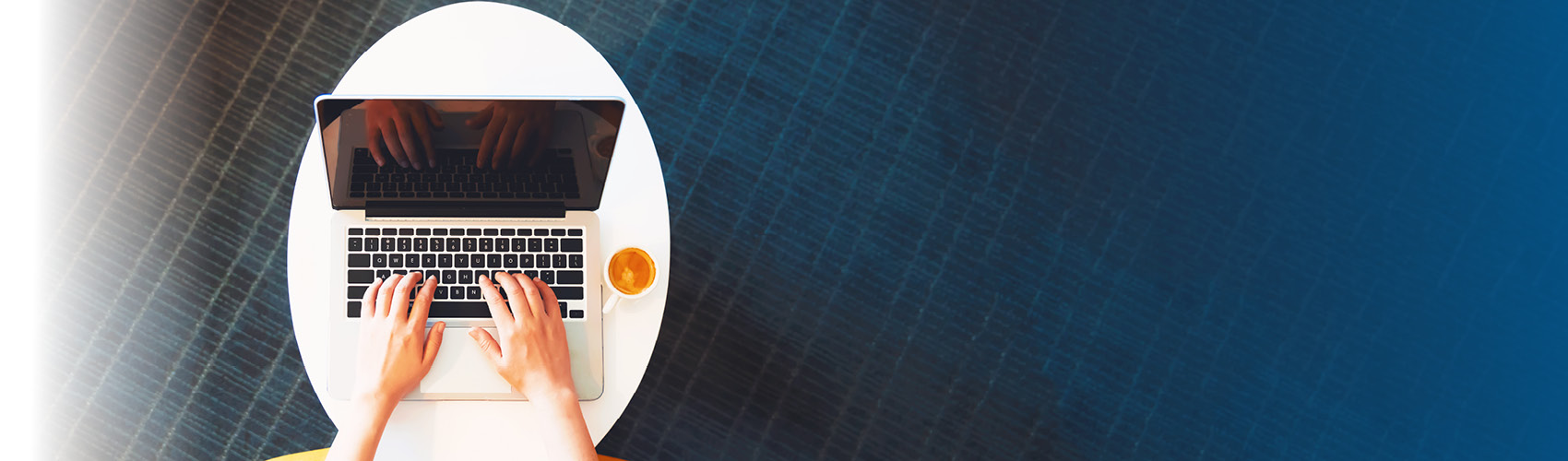 person typing on laptop