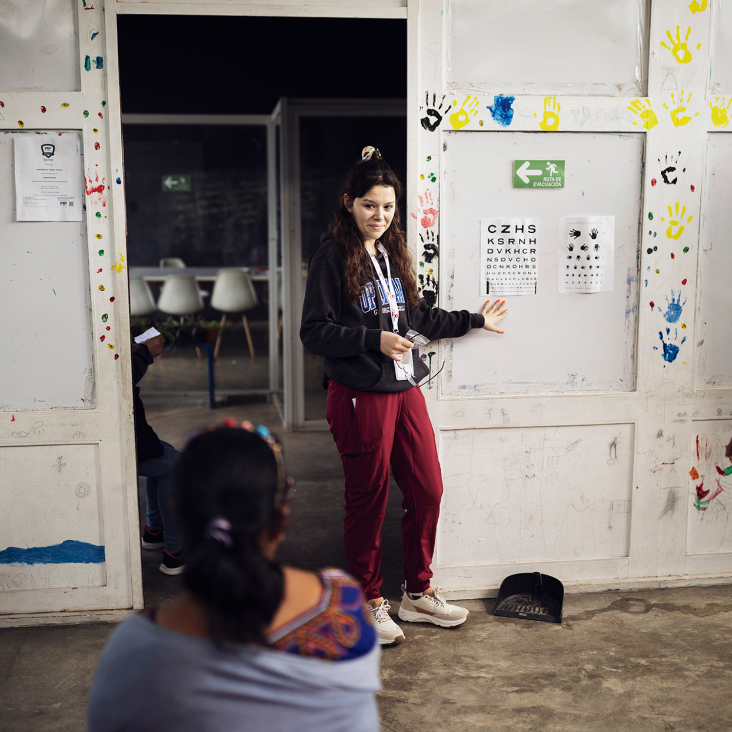 A student providing an eye test to a local in Costa Rica