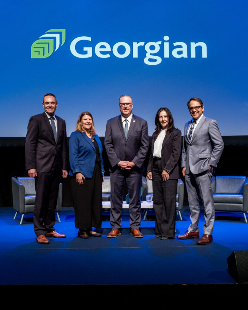 Evening with the President panel on stage.