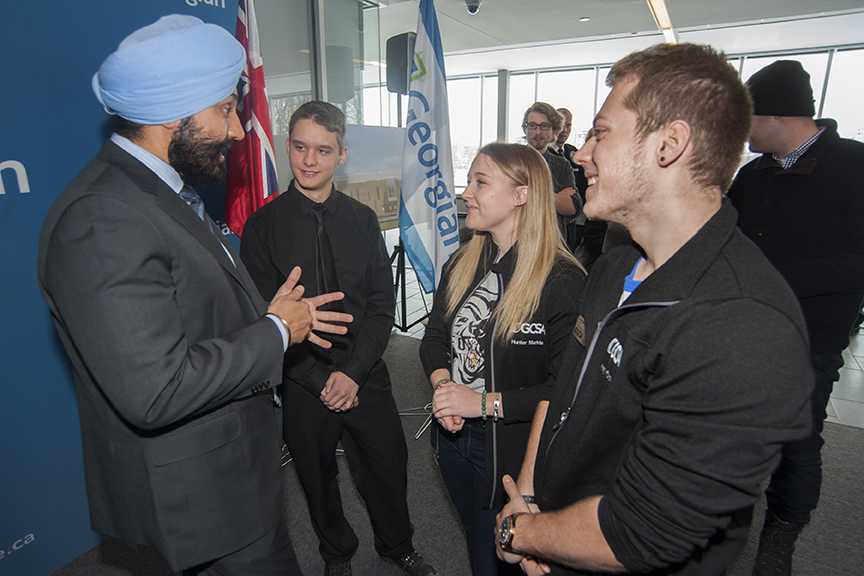 Navdeep Bains, Minister of Innovation, Science and Economic Development, chats with first-year Mechanical Engineering Technology student Mark Reckzin; Hunter Markle, Vice President, External Relations, Student Leadership and Transition Services, Georgian College Students’ Association; and GCSA President Avery Konda.