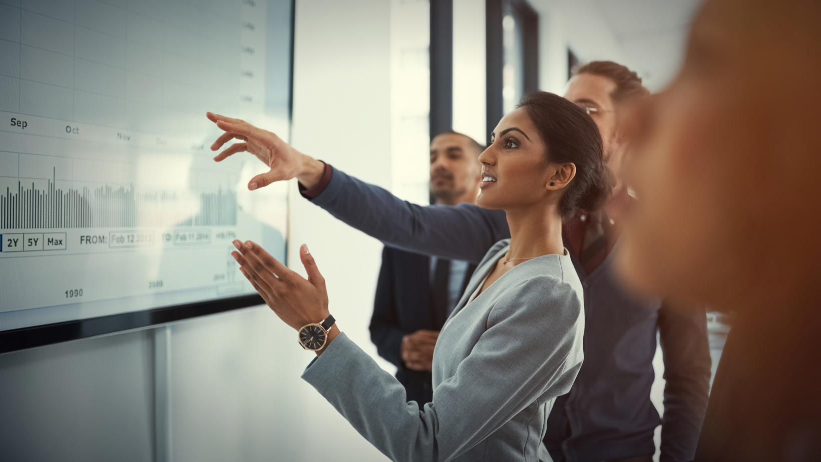 business team reviewing board with reports
