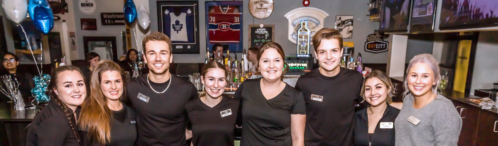 Group of student staff at TLC restaurant