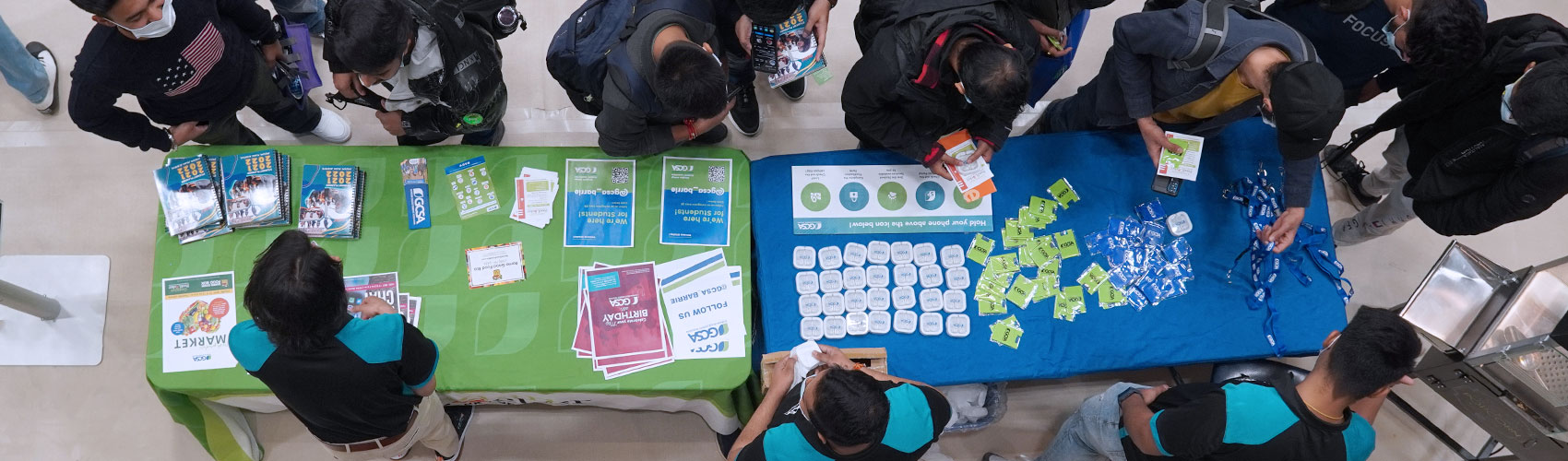Students handing out swag at orientation