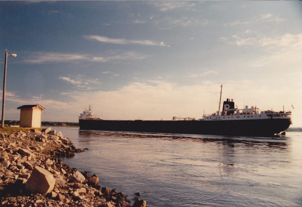 A ship on a lake.
