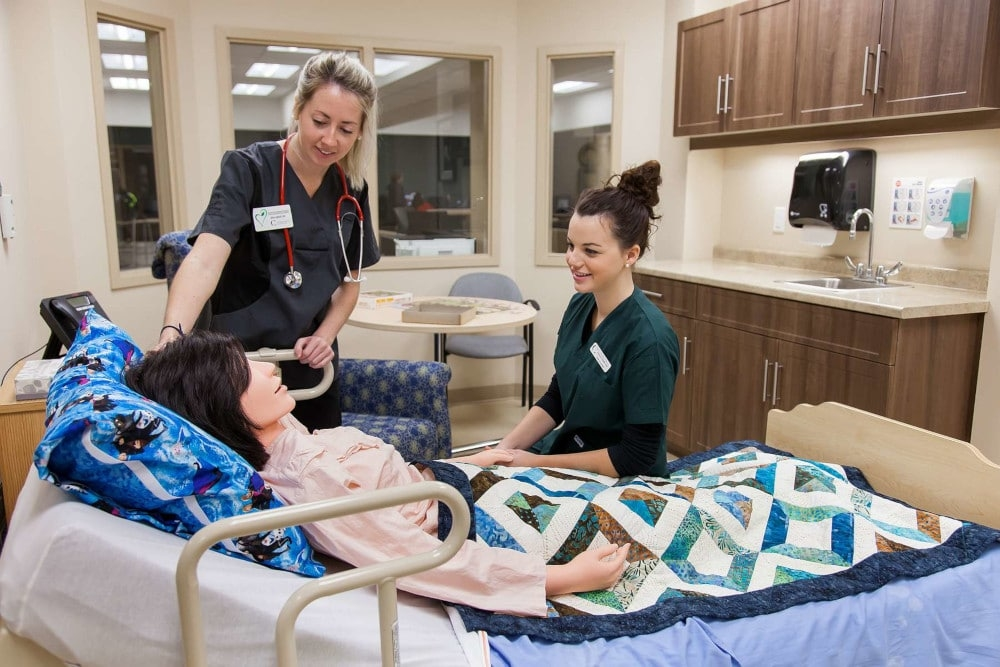 Two healthcare students in the Living Classroom at Schlegel Villages