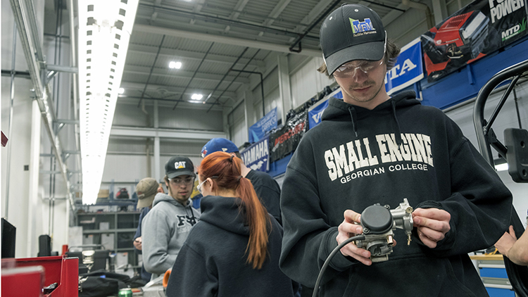 Male-and-female-Mechanical-Techniques-Small-Engine-Mechanics-work-in-Skilled-Trades-Centre