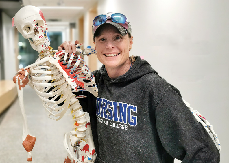 A person standing with a skeleton