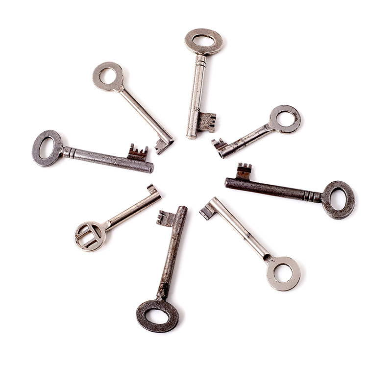 Old key on white background