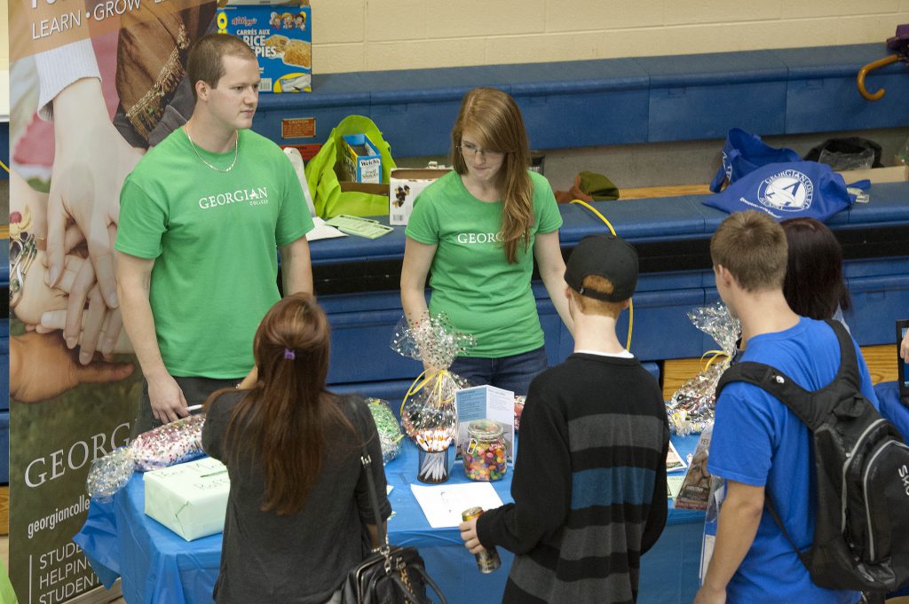 Two volunteers at the Georgian vendor fair
