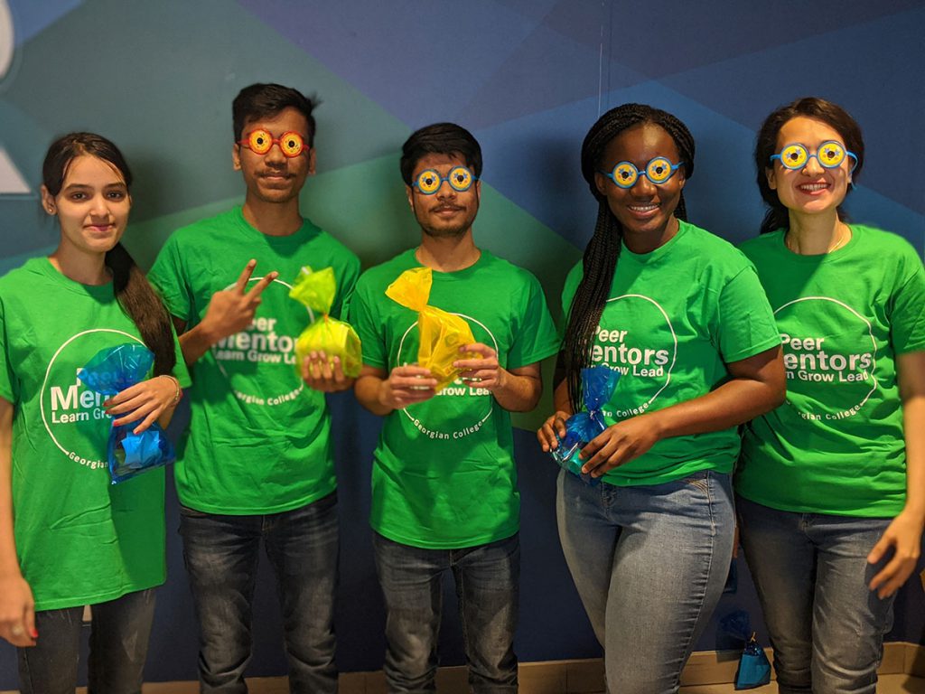 Five Peer Mentors posing for a picture