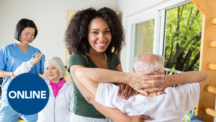 Two recreation workers aiding two elderly patients with exercises and stretches