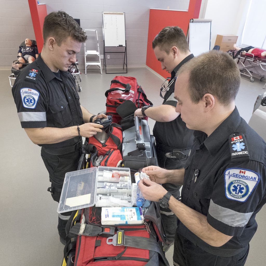 Paramedic students stocking supplies