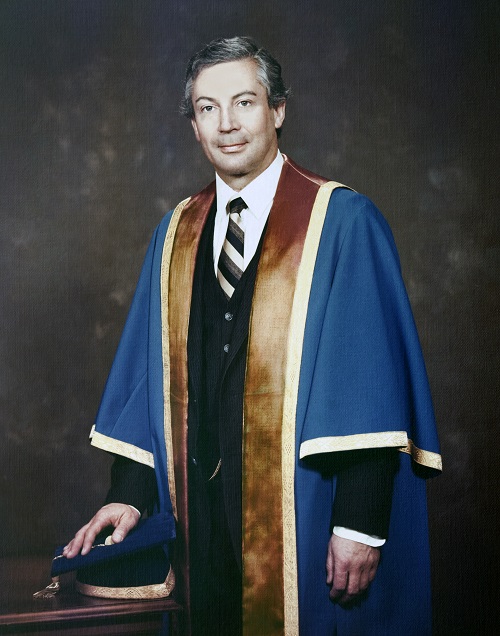 A younger past president Wayne Busch in Georgian gown