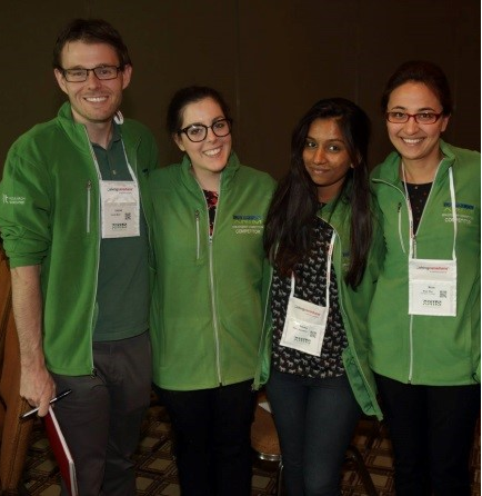 A group of Research Analyst students from Georgian College in green jackets at a national conference