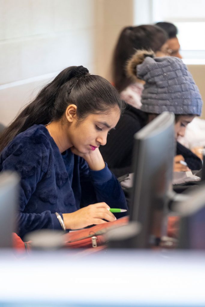 Female student studying in a computer lab