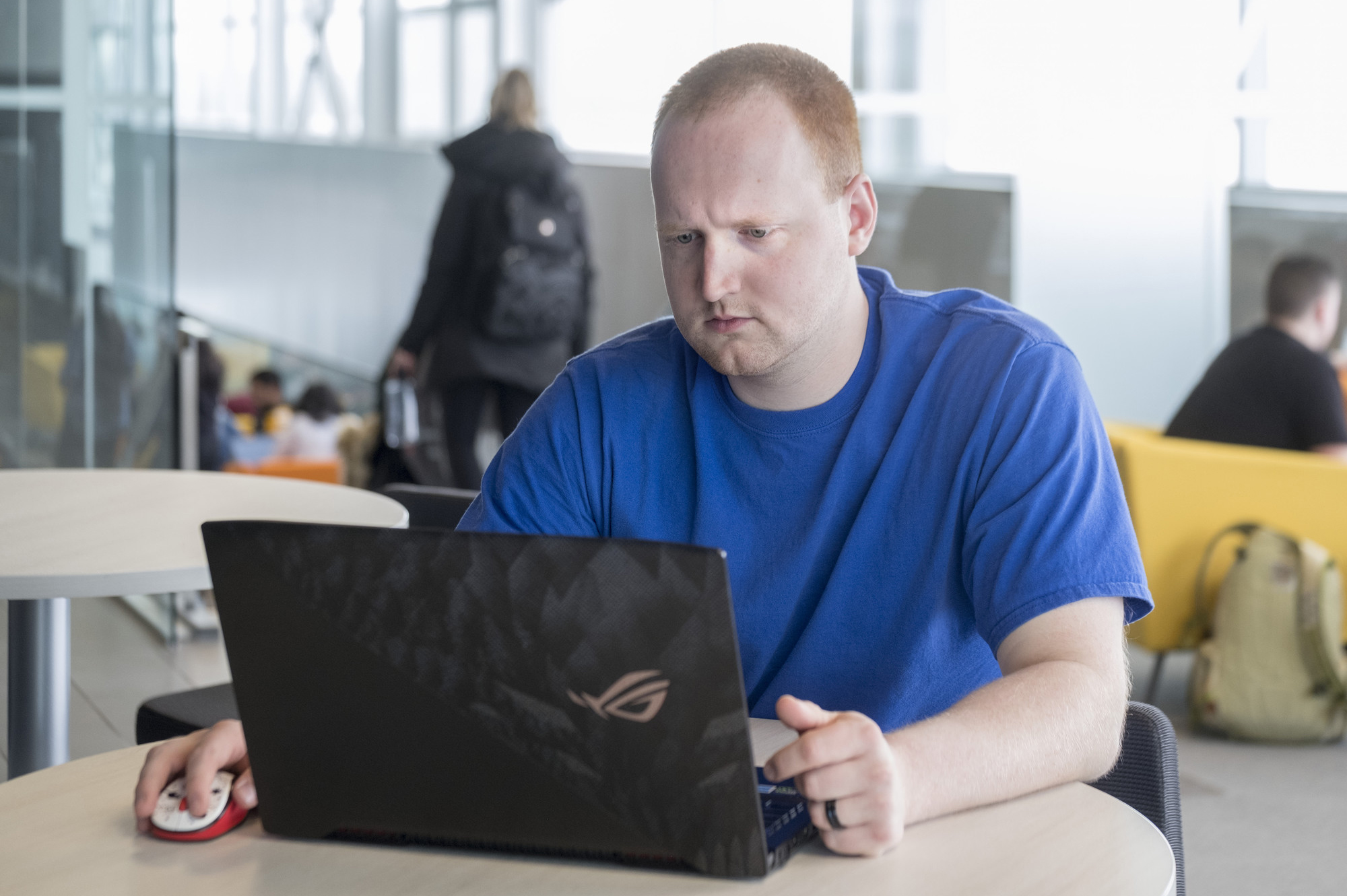 Male students sitting on a computer