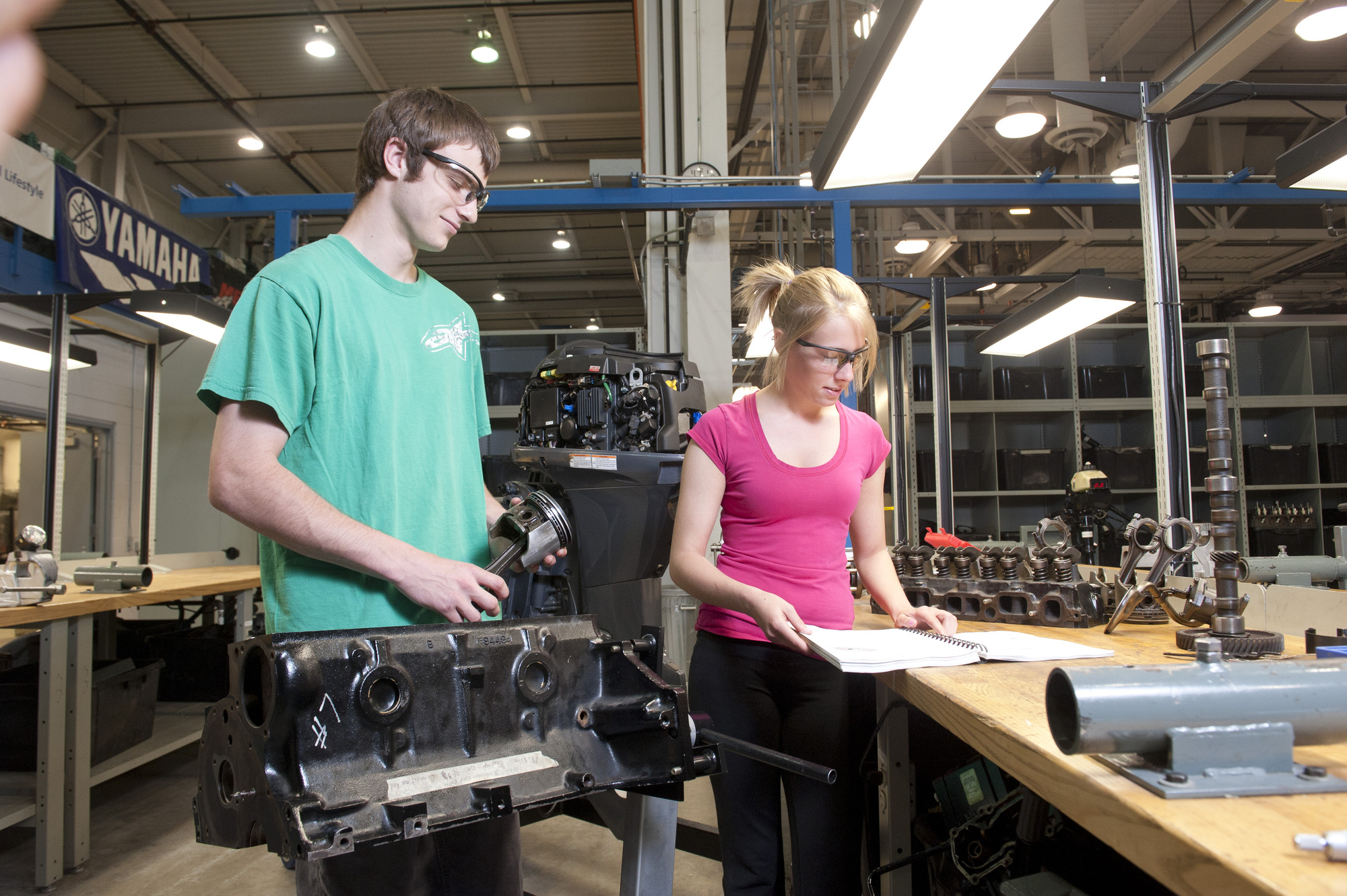 Marine Small Engine Mechanic students working in the shop