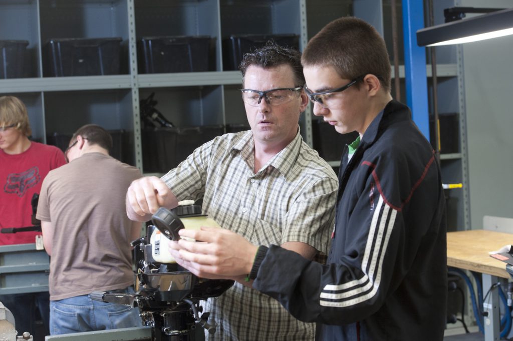 Student working with faculty member on a skilled trades