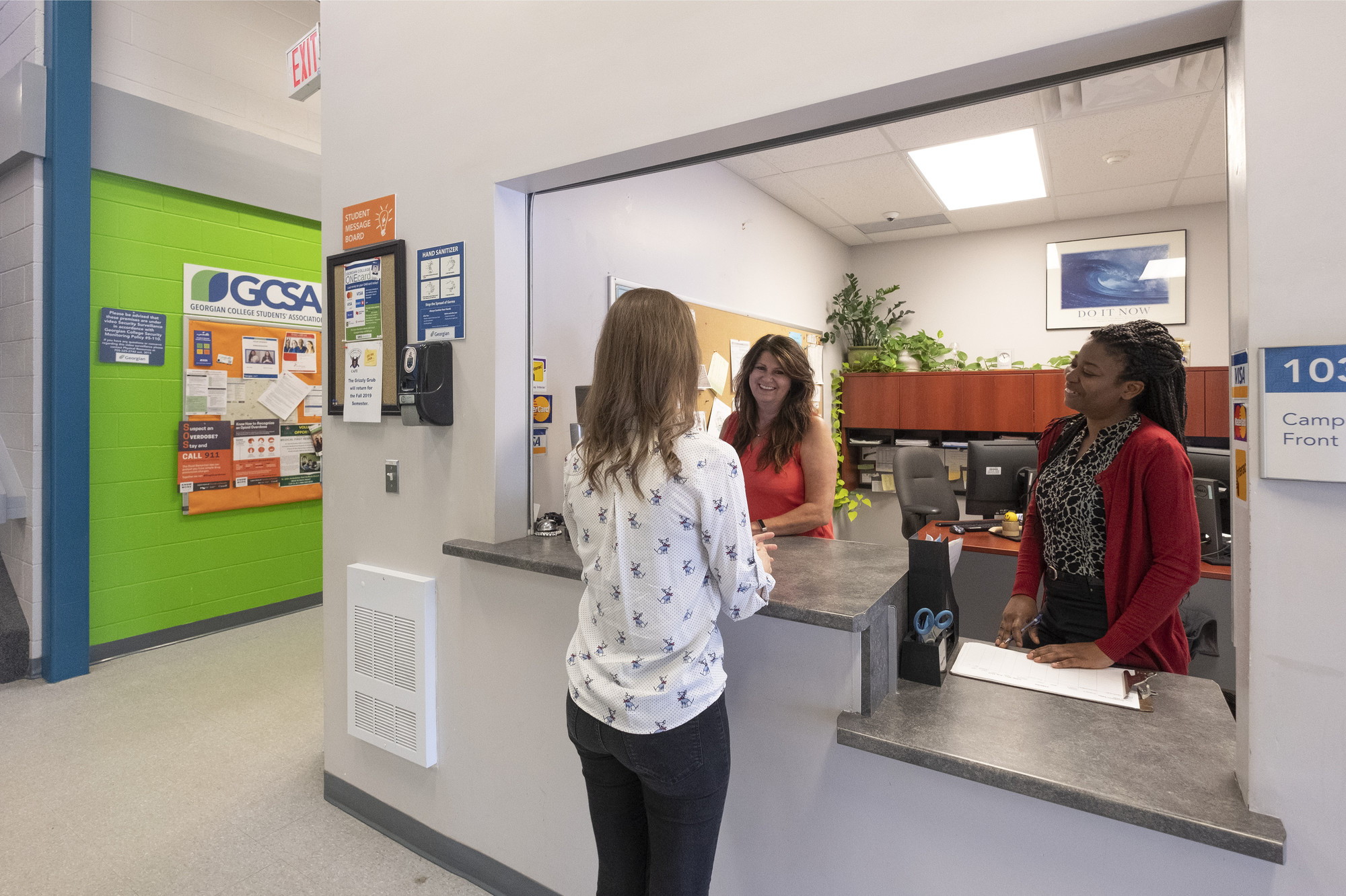 Student at the Orangeville Campus asking for support from the Orangeville staff