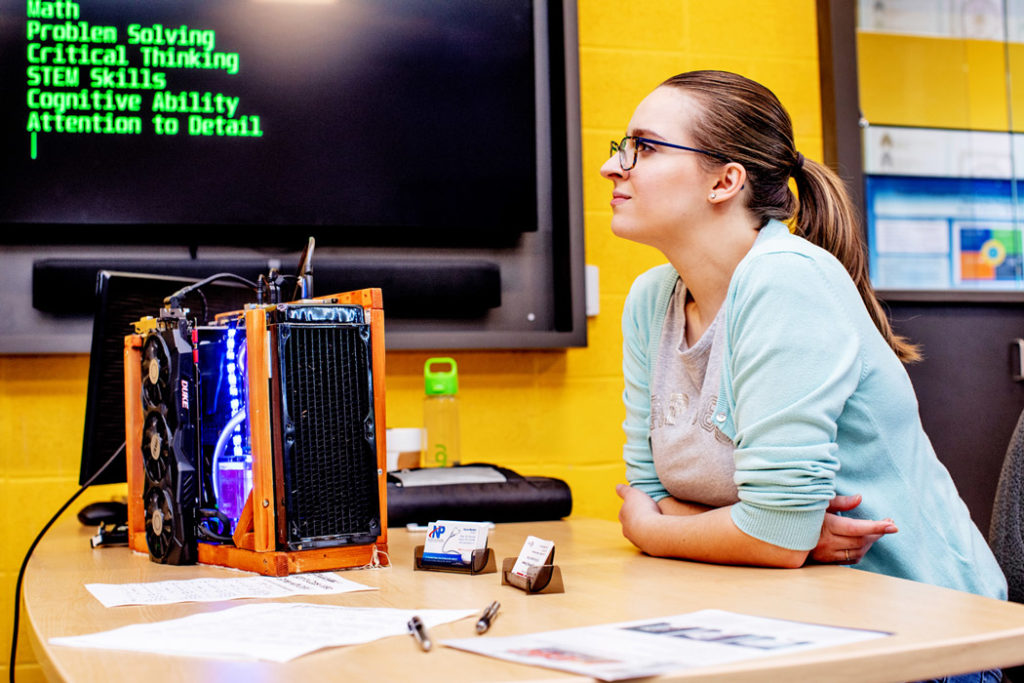 Woman working on computer build