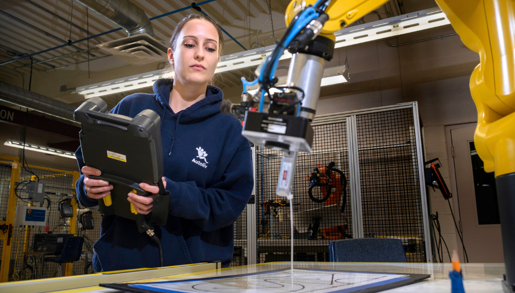 A student using technical equipment.