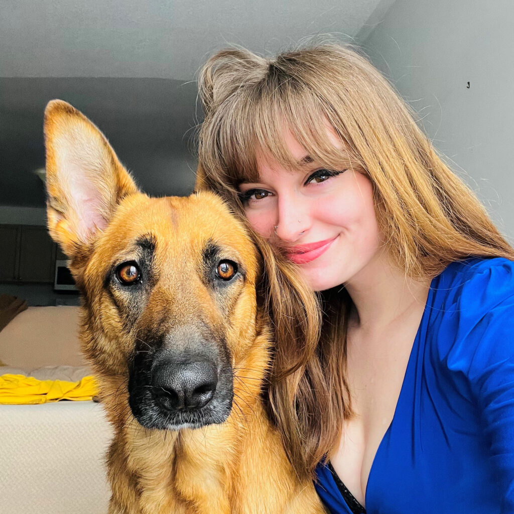 Samantha Stratton with her dog, a German Shepard.