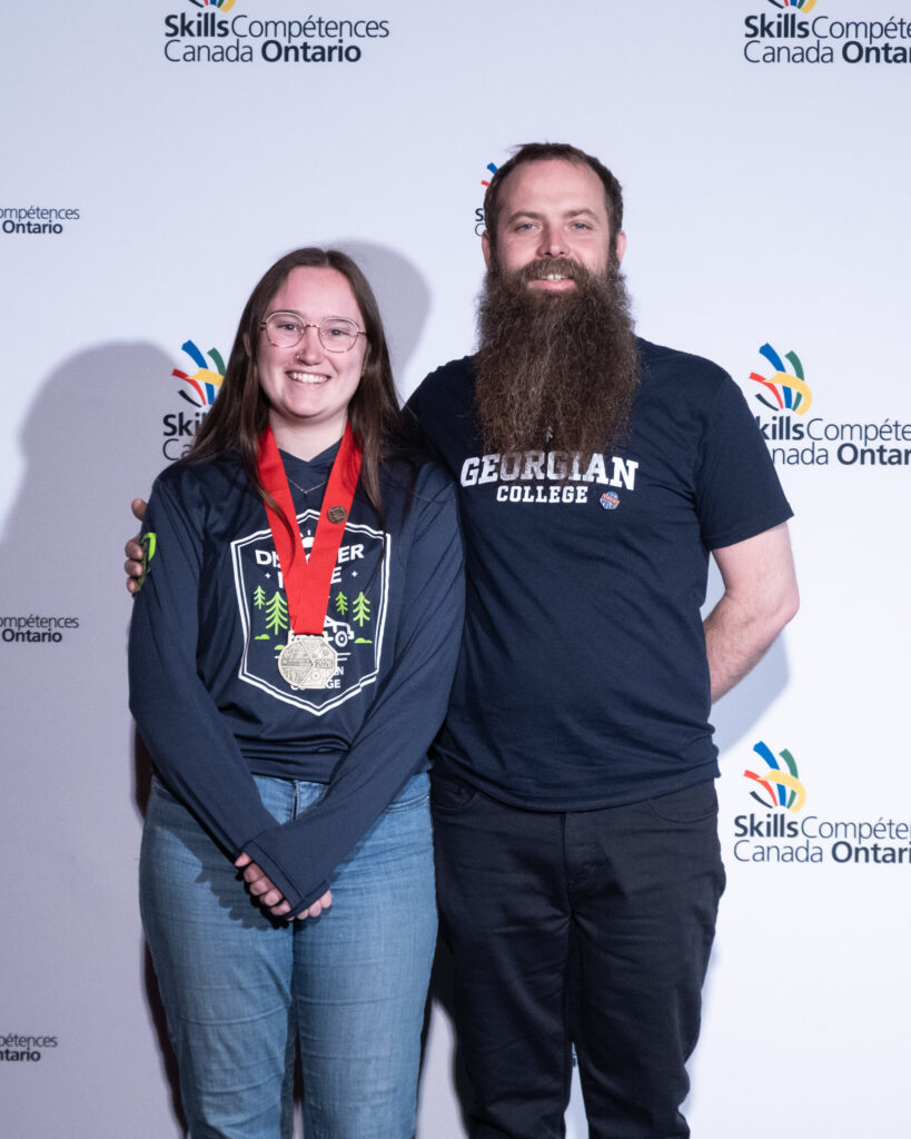 Marley Gaspirc, left, with mentor and Georgian faculty Brett Austin.