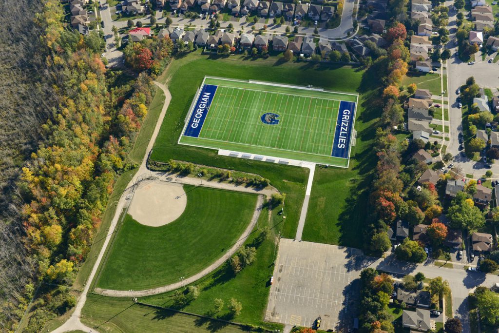 Sports field and baseball diamond with nearby parking lot