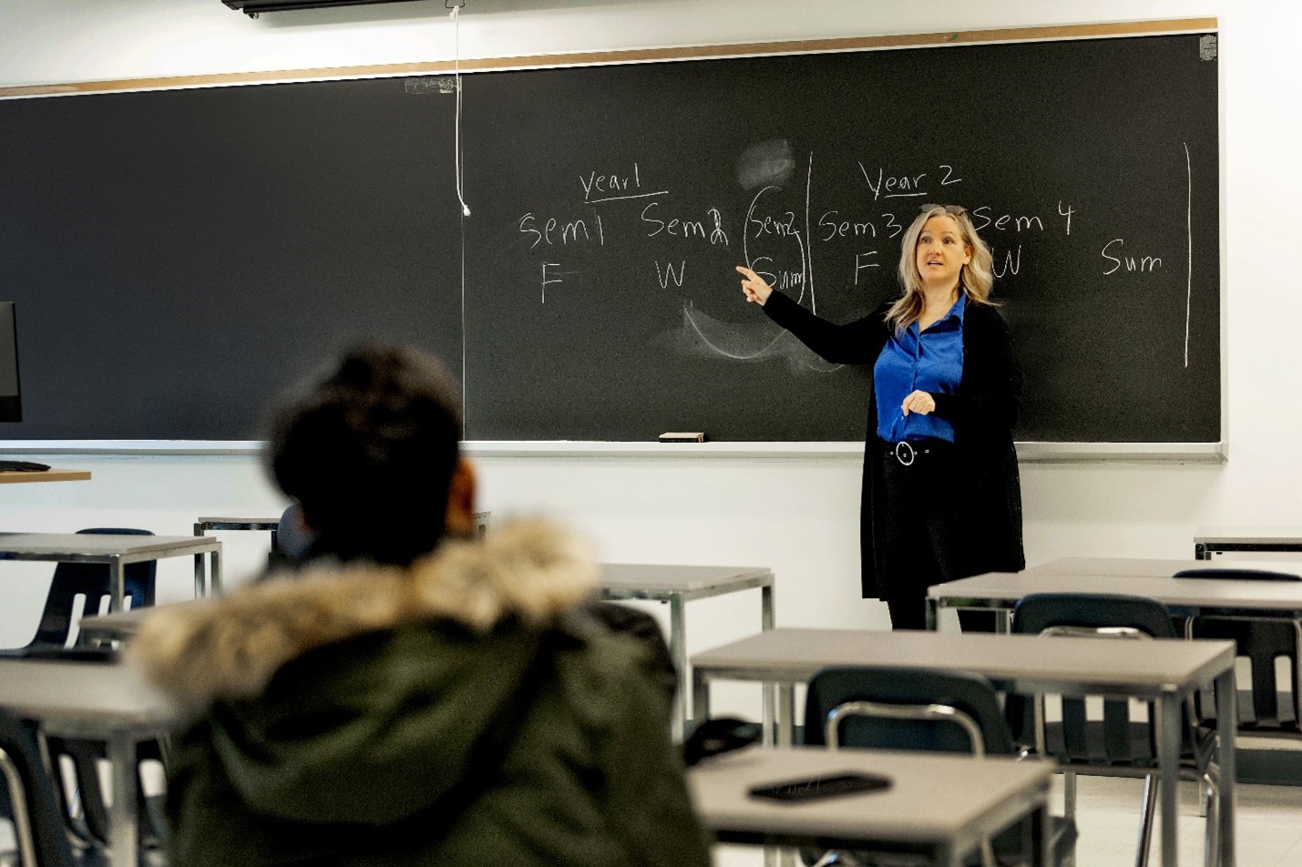 Students and professor in classroom.