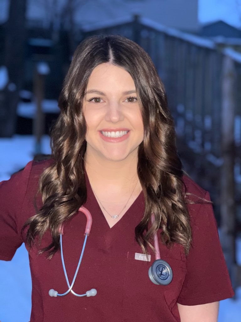 Sarah Waltman in scrubs