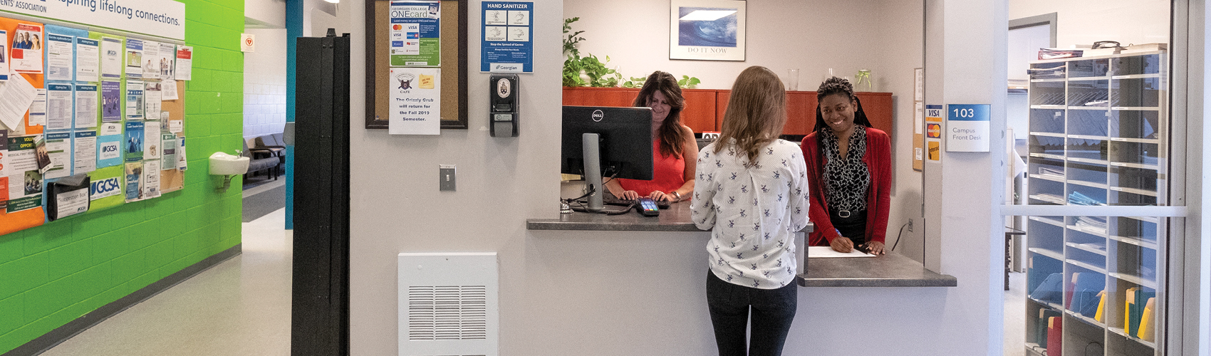 Student at the window receiving support at the Orangeville Campus