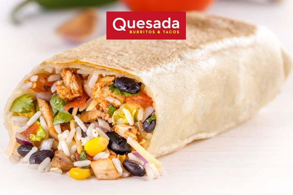 Quesada Burritos & Tacos - featuring a burrito in a white wrap filled with white rice, chicken, black beans, onions, tomatoes, corn and cilantro