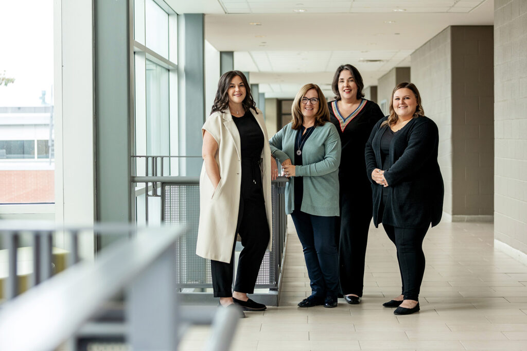 Group photo of the Conflict Resolution and Investigations team at СŶƵ: Meghan MacDonald, Catherine Gillespie, April Nietzschmann, and Rebecca Pappas