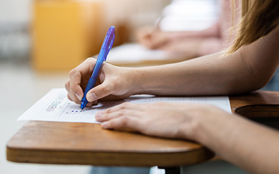 Image showing hand of a student writing on paper