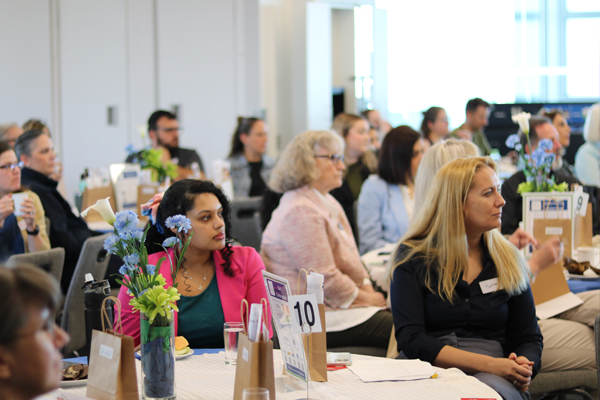 Image of a group of audience attending an event