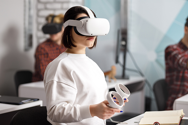 Young woman using VR headset