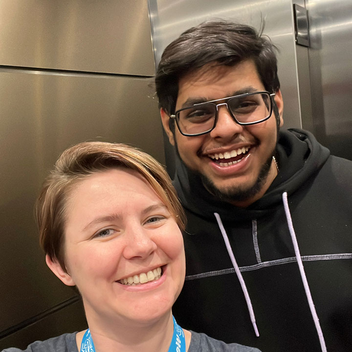 A smiling female (Virginia Barlow) in a selfie with a smiling male.