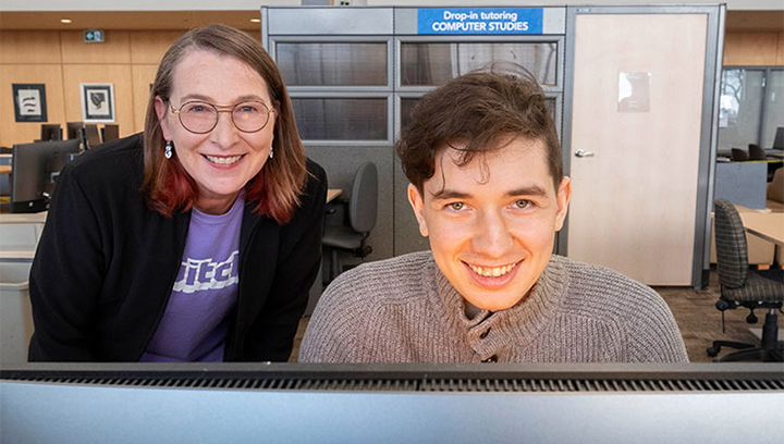 Carol Meissner, Georgian College’s Manager, Esports, and Mikel Varvaro, President of the CyberGrizzlies esports student club inside the library at the Georgian College Barrie Campus