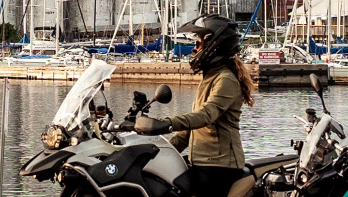 Motorcyclist at a marina.