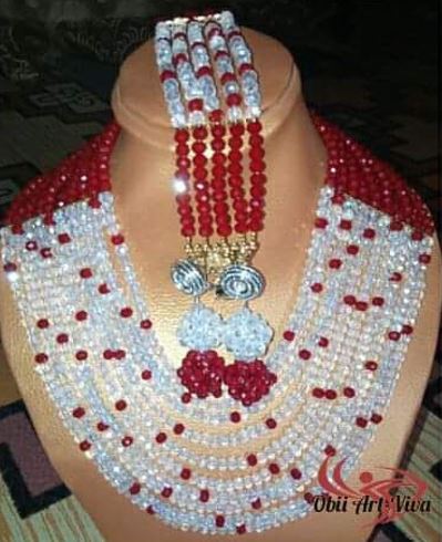 Beaded necklace and earrings on display.