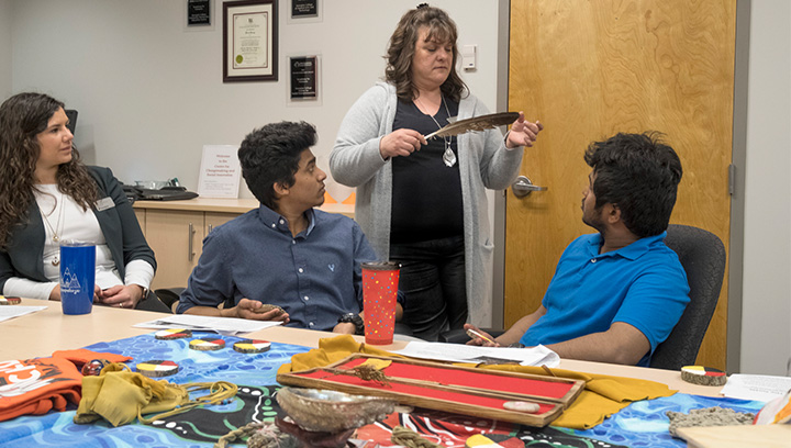 Three students and a professor inside the Indigenous Enterprises CIP lab at the Georgian College Orillia Campus