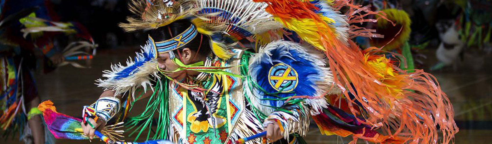 person of Indigenous ancestry wearing traditional Indigenous clothing at the Georgian College Pow Wow
