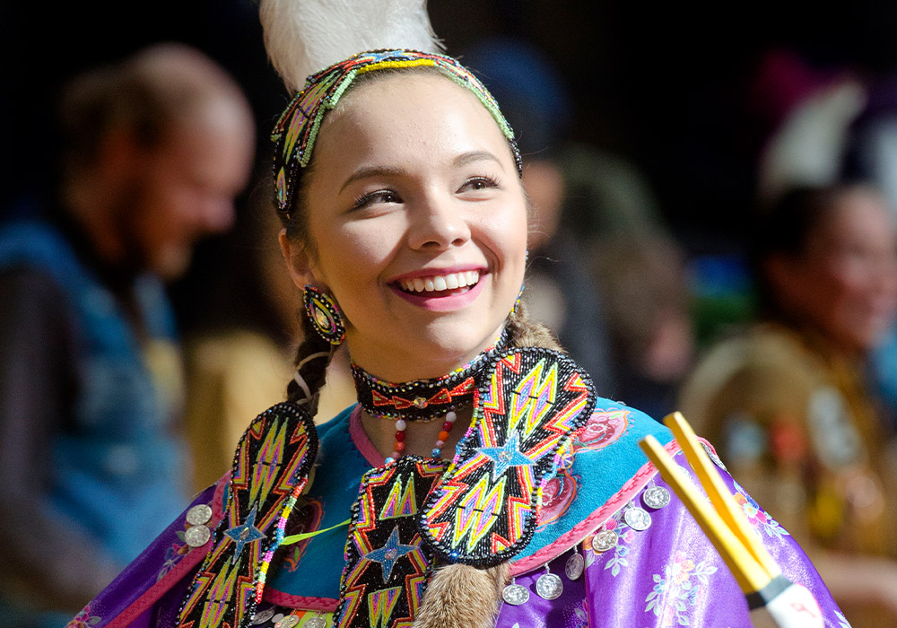 Woman wearing traditional Indigenous clothing at the Georgian College Pow Wow