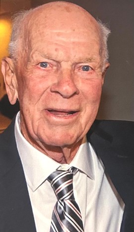 John Holland, man in a suit and tie