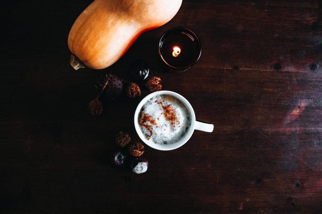 Coffee cup near gourd