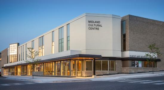 A big grey building with vertical windows and Midland Cultural Centre lettering on the front