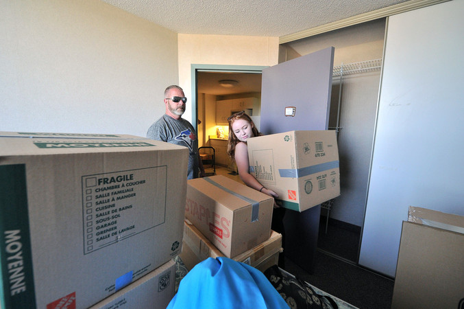 Dad helping daughter move into residence