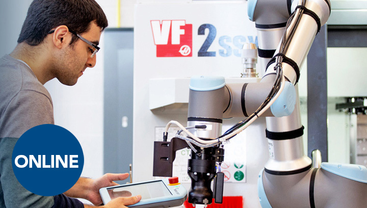 An AI technologist with short, brown hair and glasses using a controller to program a machine with artificial intelligence